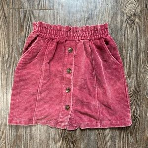 Dark pink(ish) skirt with dark brown buttons